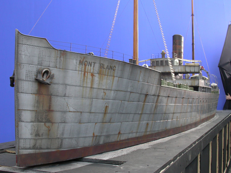 Scale model of a rusted ship.